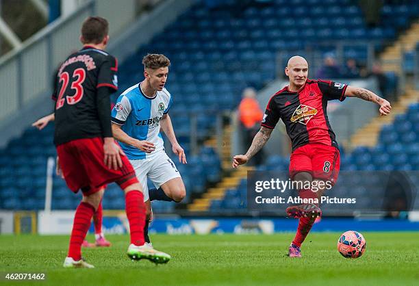 Jonjo Shelvey of Swansea City passes the ball out during the FA Cup Fourth Round match between Blackburn Rovers and Swansea City at Ewood park on...