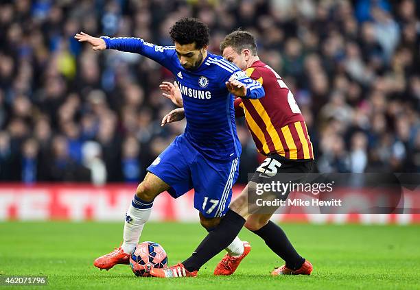 Mohamed Salah of Chelsea is tackled by Andrew Halliday of Bradford City during the FA Cup Fourth Round match between Chelsea and Bradford City at...