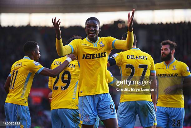 Yaya Sanogo of Crystal Palace celebrates as Marouane Chamakh scores their third goal during the FA Cup Fourth Round match between Southampton and...