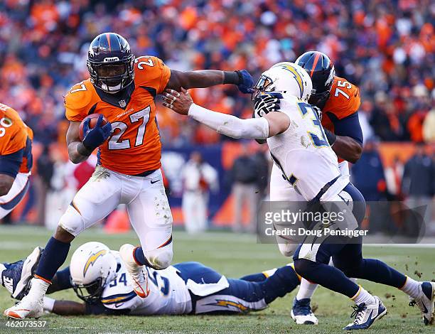 Knowshon Moreno of the Denver Broncos carries the ball against the defense of Eric Weddle of the San Diego Chargers in the second quarter during the...