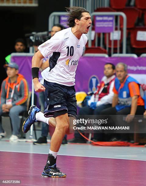 Argentina's Federico Vieyra celebrates after scoring a goal during the 24th Men's Handball World Championships preliminary round Group D match...