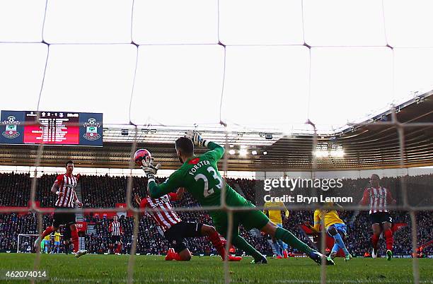 Yaya Sanogo of Crystal Palace shoots past Fraser Forster of Southampton to score their second goal during the FA Cup Fourth Round match between...