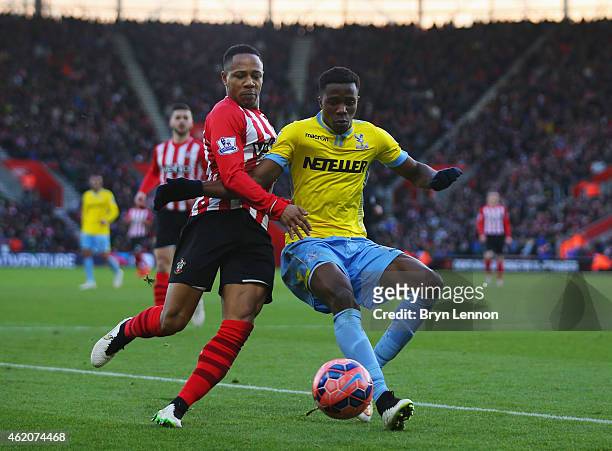 Wilfried Zaha of Crystal Palace and Nathaniel Clyne of Southampton battle for the ball during the FA Cup Fourth Round match between Southampton and...