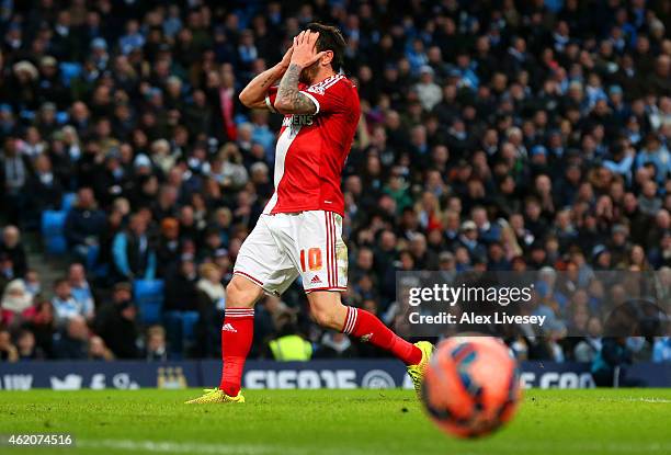 Lee Tomlin of Middlesbrough reacts after hitting the post with an effort during the FA Cup Fourth Round match between Manchester City and...