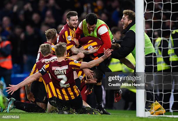 Andrew Halliday of Bradford City is congratulated by teammates after scoring his team's third goal during the FA Cup Fourth Round match between...