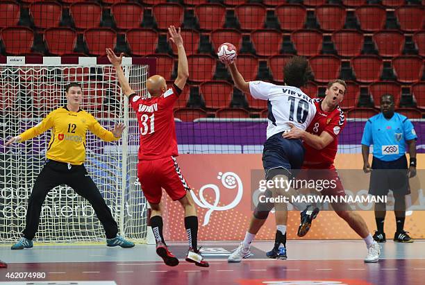 Argentina's Federico Vieyra takes a shot on goal a sRussia's Egor Evdokimov , Timur Dibirov and Vadim Bogdanov defend during the 24th Men's Handball...