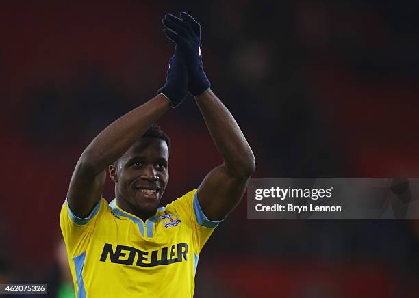 Wilfried Zaha of Crystal Palace applauds the crowd after victory in the FA Cup Fourth Round match between Southampton and Crystal Palace at St Mary's...