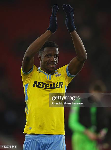 Wilfried Zaha of Crystal Palace applauds the crowd after victory in the FA Cup Fourth Round match between Southampton and Crystal Palace at St Mary's...