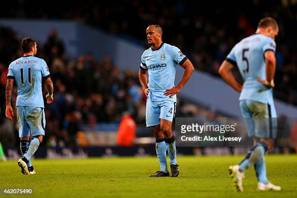 Vincent Kompany , Aleksandar Kolarov and Pablo Zabaleta of Manchester City show their dejection after conceding a goal during the FA Cup Fourth Round...
