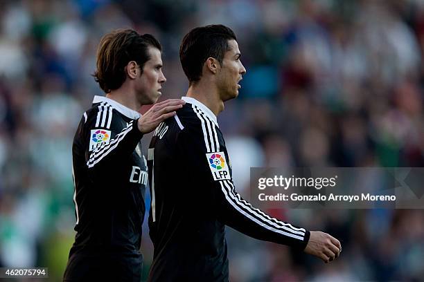 Gareth Bale of Real Madrid CF consoles his teammate Cristiano Ronaldo as he leaves the pitch after being reprimanded with a red card during the La...