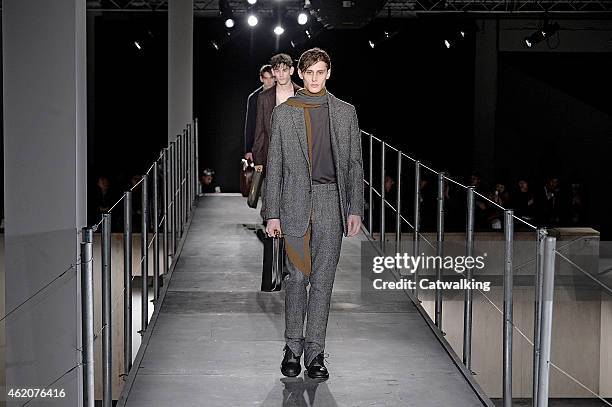 Model walks the runway at the Wooyoungmi Autumn Winter 2015 fashion show during Paris Menswear Fashion Week on January 24, 2015 in Paris, France.