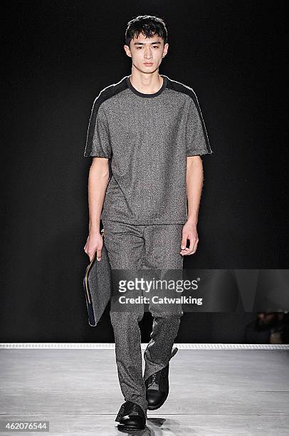 Model walks the runway at the Wooyoungmi Autumn Winter 2015 fashion show during Paris Menswear Fashion Week on January 24, 2015 in Paris, France.