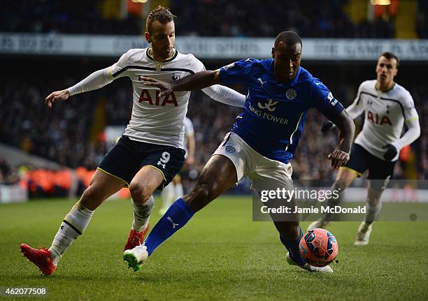 Wes Morgan of Leicester City is challenged by Roberto Soldado of Spurs during the FA Cup Fourth Round match between Tottenham Hotspur and Leicester...