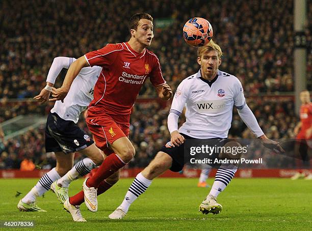 Javier Manquillo of Liverpool bursts past Tim Ream of Bolton during the FA Cup Fourth Round match between Liverpool and Bolton Wanderers at Anfield...