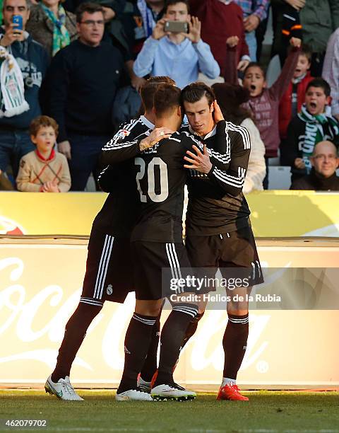 Gareth Bale and Jese Rodriguez of Real Madrid celebrate after scoring during the liga match between Cordoba CF and Real Madrid CF at Nuevo Arcange on...