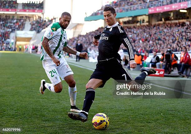 Cristiano Ronaldo of Real Madrid and Tiago Dias "Bebe" of Cordoba compete for the ball during the liga match between Cordoba CF and Real Madrid CF at...