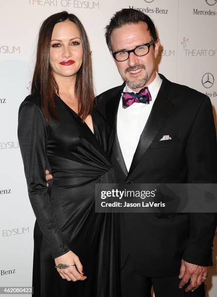 Christina McLarty and David Arquette attend the Art of Elysium's 7th annual Heavan gala at Skirball Cultural Center on January 11, 2014 in Los...