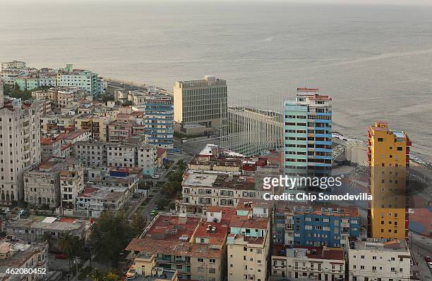 The seven-story tall U.S. Interests Section building stands along the historic Malecon oceanfront drive January 23, 2015 in Havana, Cuba. As the...