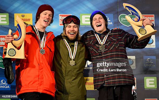 First placed Roope Tonteri of Finland poses with second placed Darcy Sharpe of Canada and third placed Kyle Mack of USA after the Men's Big Air...