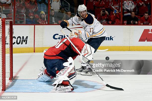 Philipp Grubauer of the Washington Capitals makes a save against Linus Omark of the Buffalo Sabres during a shootout at Verizon Center on January 12,...