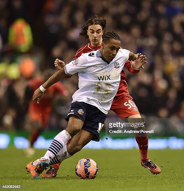 Lazar Markovic of Liverpool competes with Neil Danns of Bolton during the FA Cup Fourth Round match between Liverpool and Bolton Wanderers at Anfield...