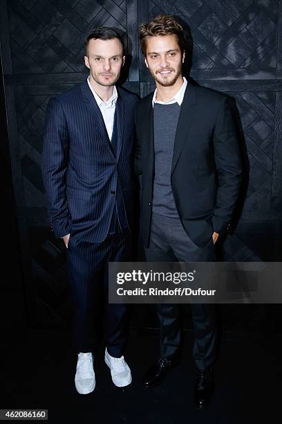 Fashion designer Kris Van Assche and Actor of movie 'Fifty shades of grey' Luke Grimes pose backstage after the Dior Homme Menswear Fall/Winter...