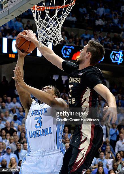 Boris Bojanovsky of the Florida State Seminoles blocks a shot by Kennedy Meeks of the North Carolina Tar Heels during their game at the Dean Smith...