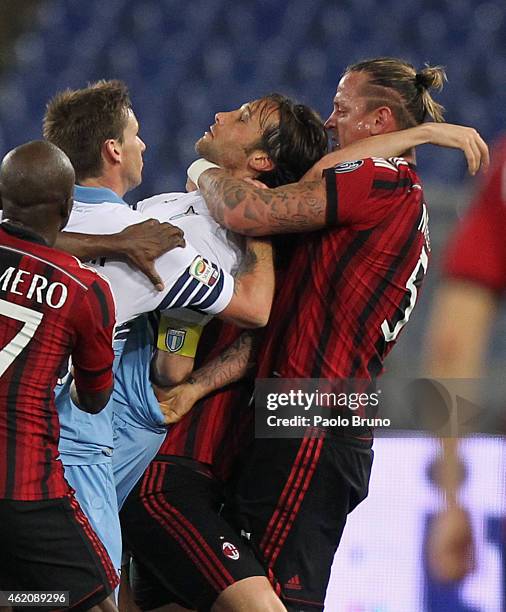 Philippe Mexes of AC Milan and Stefano Mauri of SS Lazio react during the Serie A match between SS Lazio and AC Milan at Stadio Olimpico on January...