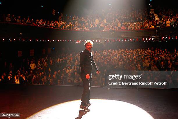 Humorist Alex Lutz acknowledges the applause of the audience at the end of his One man Show at L'Olympia on January 24, 2015 in Paris, France.