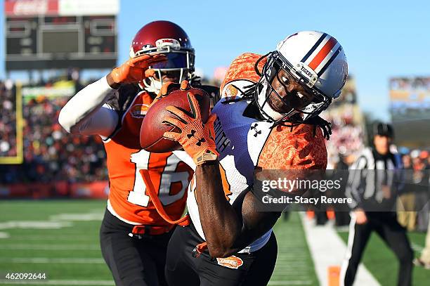 Sammie Coates of the South team catches a pass in front of Josh Shaw of the North team during the second quarter of the Reese's Senior Bowl at Ladd...