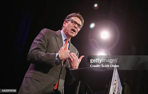 Former Texas Governor Rick Perry speaks to guests at the Iowa Freedom Summit on January 24, 2015 in Des Moines, Iowa. The summit is hosting a group...
