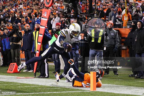 Keenan Allen of the San Diego Chargers scores a fourth quarter touchdown against Michael Huff of the Denver Broncos during the AFC Divisional Playoff...