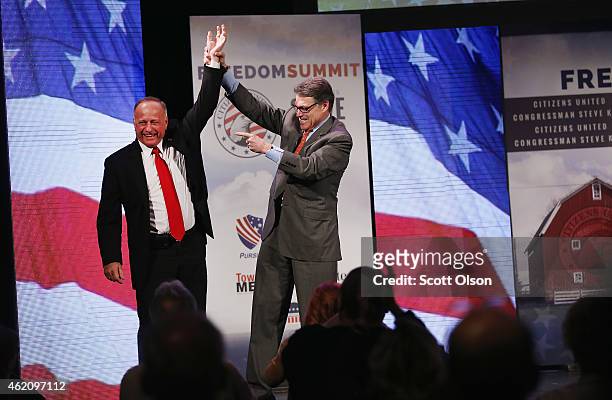 Representative Steve King and former Texas Governor Rick Perry attend the Iowa Freedom Summit on January 24, 2015 in Des Moines, Iowa. The summit is...