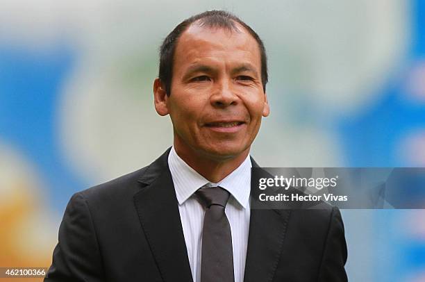 Jose Guadalupe Cruz Head Coach of Puebla smiles during a match between America and Puebla as part of 3rd round Clausura 2015 Liga MX at Azteca...