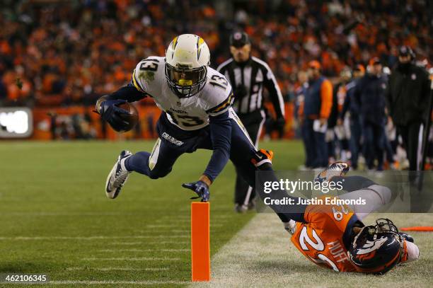 Keenan Allen of the San Diego Chargers scores a fourth quarter touchdown against Michael Huff of the Denver Broncos during the AFC Divisional Playoff...