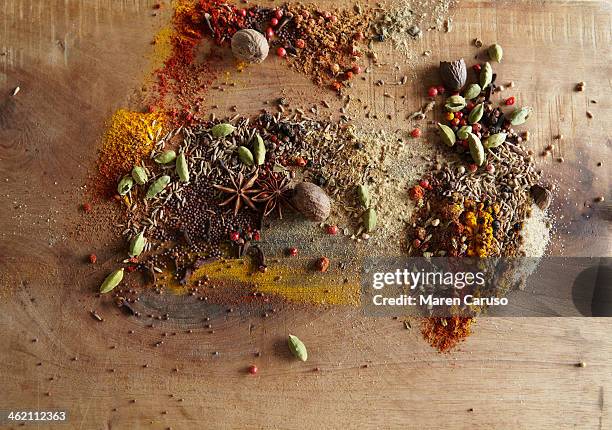Spices Piled On Wood Surface High-Res Stock Photo