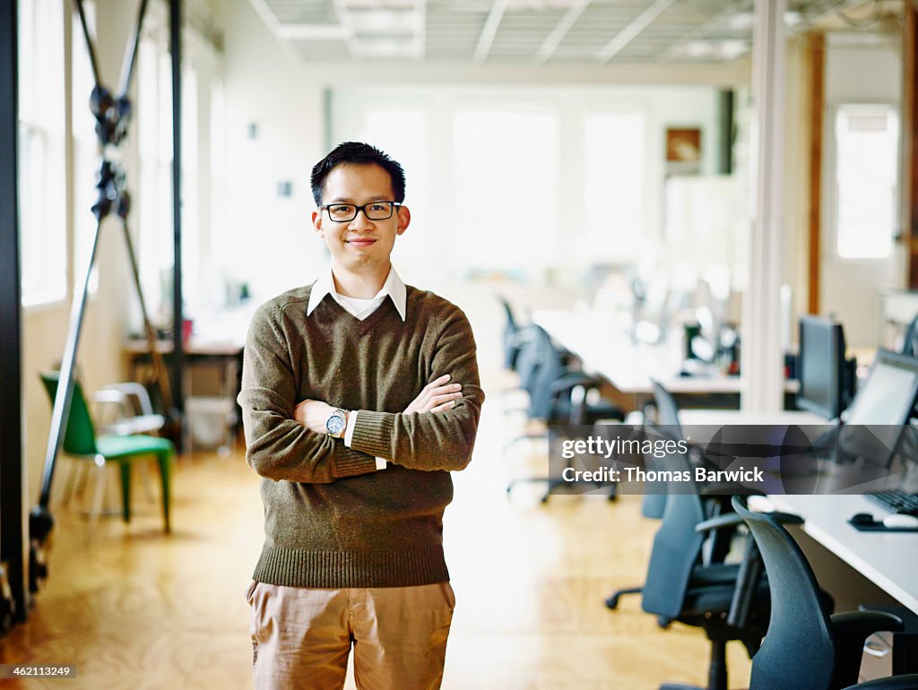 Smiling professional in high tech office