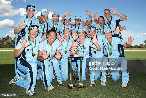 Breakers players pose with the trophy after winning the WNCL Final match between South Australia and New South Wales at Blacktown International...