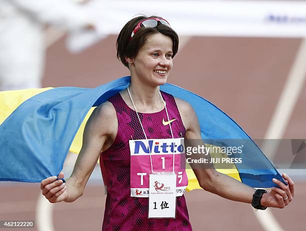 Tetyana Gamera-Shmyrko of Ukraine celebrates her win in the Osaka International Women's Marathon on January 25, 2015. Gamera won her third...