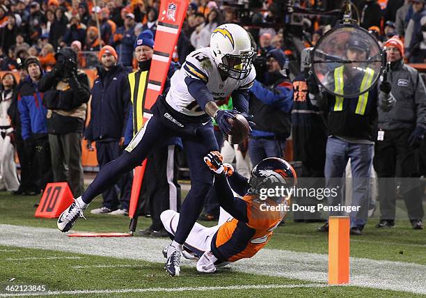 Keenan Allen of the San Diego Chargers scores a fourth quarter touchdown against Michael Huff of the Denver Broncos during the AFC Divisional Playoff...