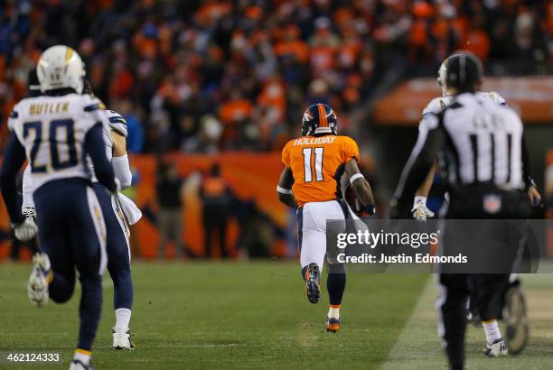 Trindon Holliday of the Denver Broncos carries the ball inthe fourth quarter against the San Diego Chargers during the AFC Divisional Playoff Game at...