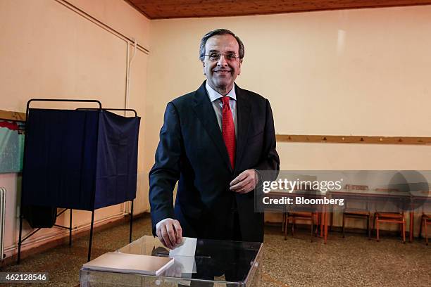 Antonis Samaras, Greece's prime minister, casts his vote at a polling station in the town of Pylos, west of Athens, Greece, on Sunday, Jan. 25, 2015....
