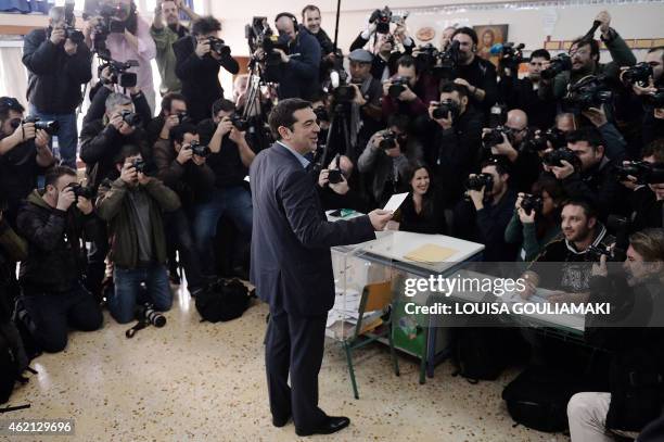 The leader of Greece's left-wing Syriza party Alexis Tsipras casts his ballot at a polling station in Athens on January, 2015. Greece votes today in...