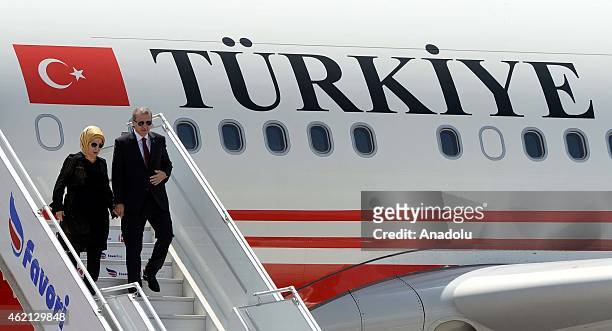 Turkish President Recep Tayyip Erdogan and his wife Emine Erdogan step out of their plane at the airport in Mogadishu, Somalia on January 25, 2015.