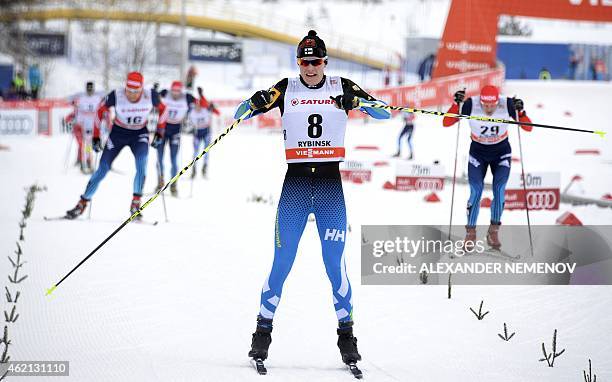 Finland's Matti Heikkinen reacts as he crosses the finish line in third place during the men's skiathlon 15 km classic + 15 km free race of the FIS...