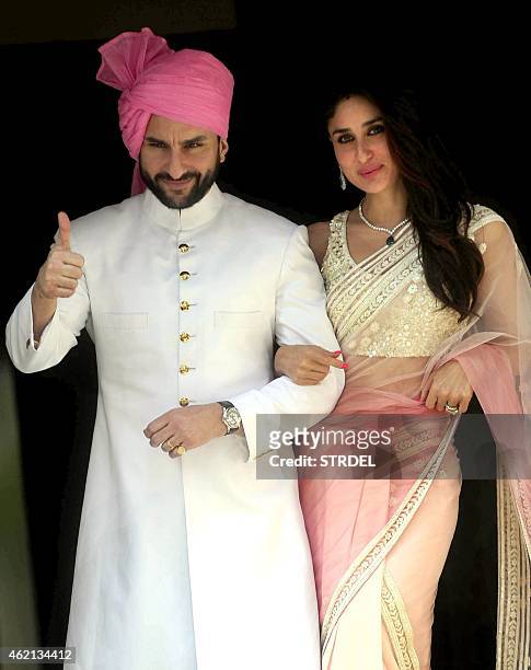 Indian Bollywood actor Saif Ali Khan with his wife Kareena Kapoor Khan attend the wedding of Soha Ali Khan and Kunal Khemu in Mumbai on January 25,...