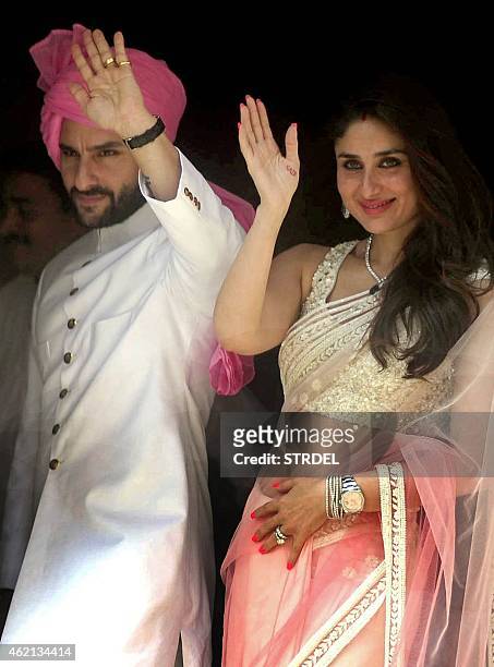 Indian Bollywood actor Saif Ali Khan with his wife Kareena Kapoor Khan attend the wedding of Soha Ali Khan and Kunal Khemu in Mumbai on January 25,...