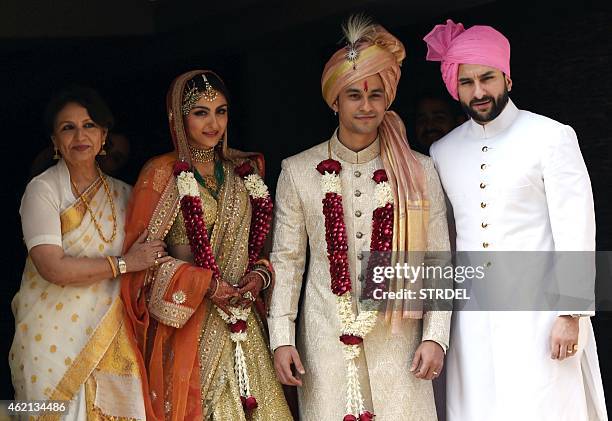 Indian Bollywood veteran actress Sharmila Tagore and Saif Ali Khan pose during the wedding of Soha Ali Khan and Kunal Khemu in Mumbai on January 25,...