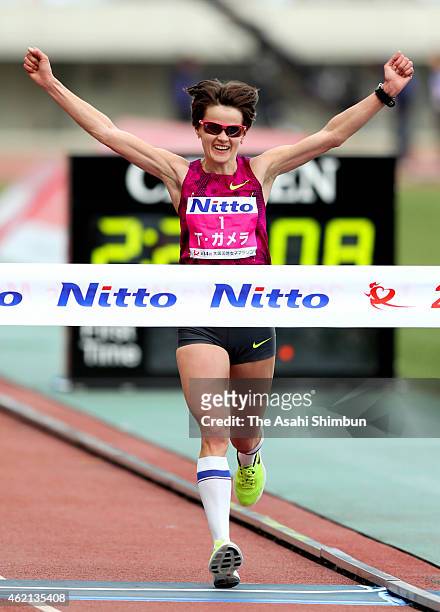 Tatiana Gamera of Russia crosses the finishing tape to win during the 2015 Osaka Women's Marathon at Nagai Stadium on January 25, 2015 in Osaka,...