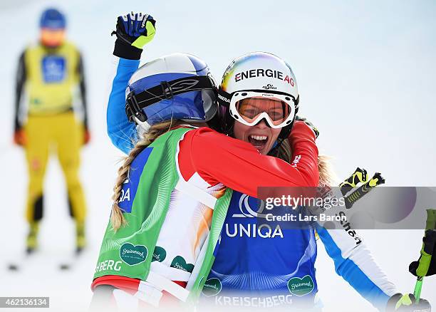 Andrea Limbacher of Austria celebrates winning gold with silver medalist Ophelie David of France in the Big Final of the Women's Ski Cross Finals...